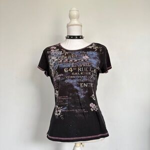 Black graphic bedazzled shirt.